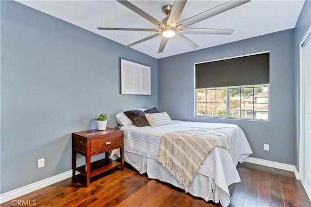 bedroom featuring ceiling fan and dark hardwood / wood-style flooring