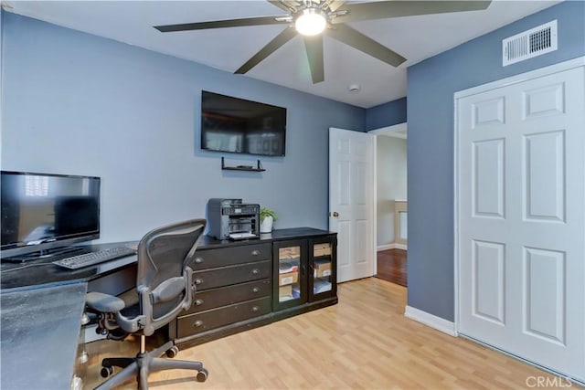 home office with light wood-type flooring