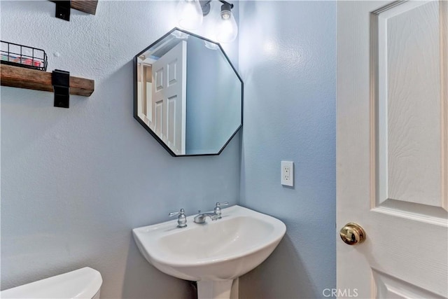 bathroom with sink and toilet