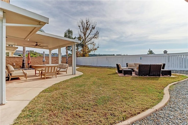 view of yard with ceiling fan, a patio area, and outdoor lounge area