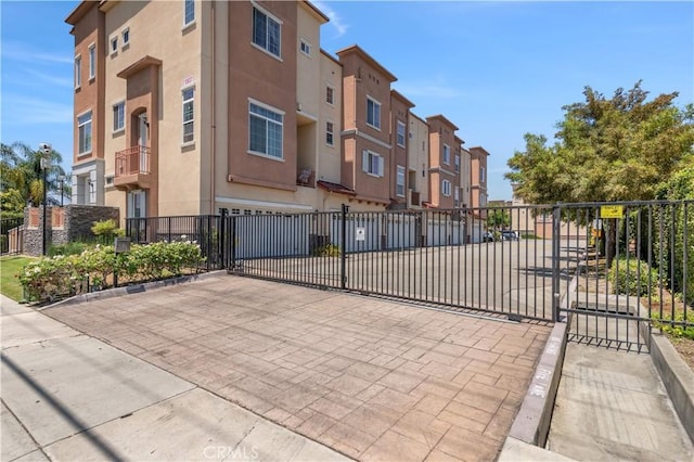 view of gate featuring a garage