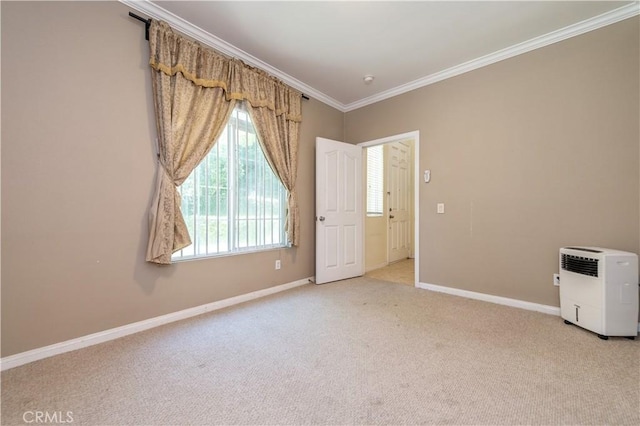 empty room with light carpet and ornamental molding