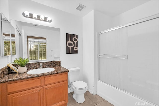 13637 Foster Ave Unit 5, Baldwin Park, CA 91706 - full bathroom with vanity, toilet, tile patterned flooring, and shower / bath combination with glass door