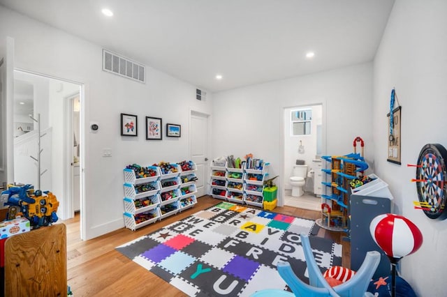 playroom featuring hardwood / wood-style flooring