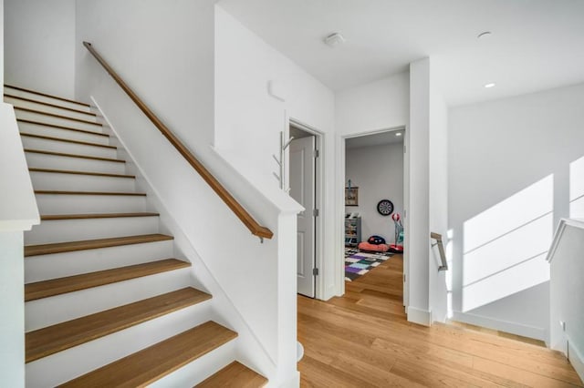 staircase featuring hardwood / wood-style floors