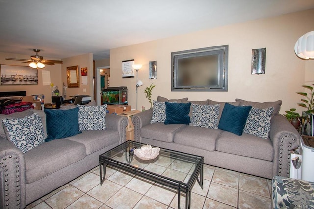 living room featuring ceiling fan and light tile patterned floors