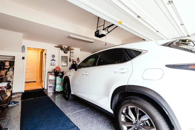 garage featuring a garage door opener and electric panel