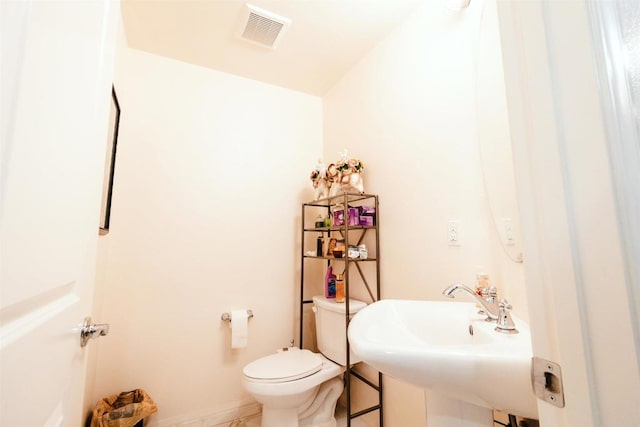 bathroom featuring sink and toilet