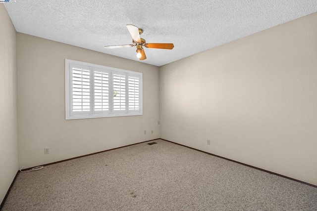 unfurnished room with carpet flooring, a textured ceiling, and ceiling fan