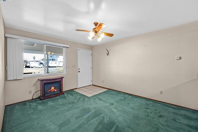 spare room with light colored carpet and ceiling fan