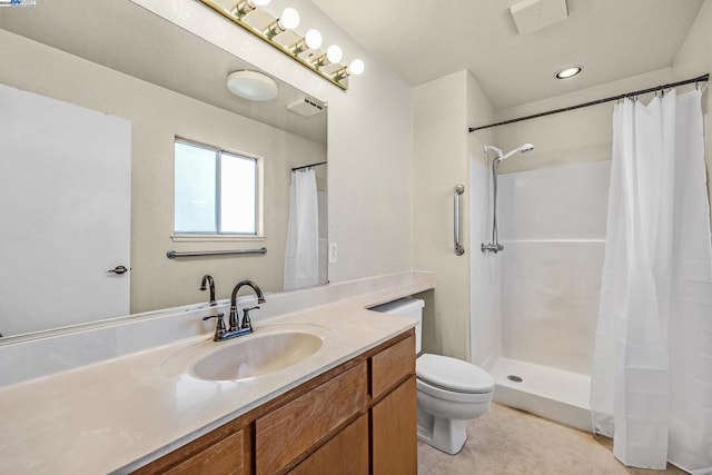 bathroom with a shower with curtain, vanity, toilet, and tile patterned flooring