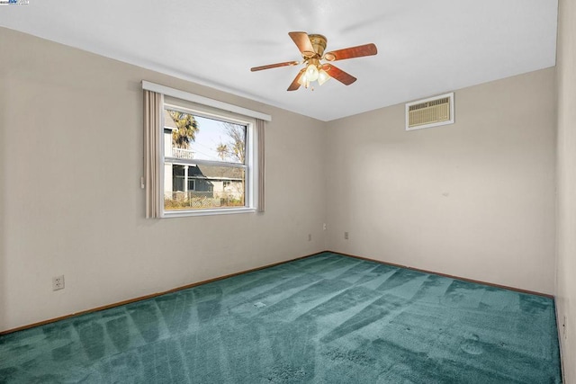 spare room with carpet floors and ceiling fan