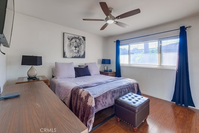 bedroom with hardwood / wood-style flooring and ceiling fan