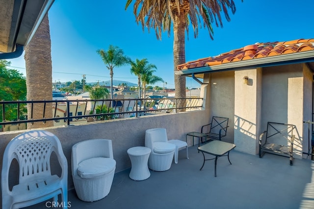 view of patio featuring a balcony