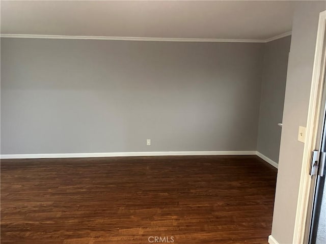 unfurnished room with dark wood-type flooring and crown molding