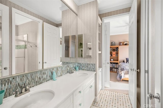 bathroom featuring vanity, ornamental molding, and tasteful backsplash