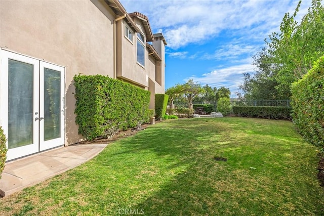 view of yard featuring french doors