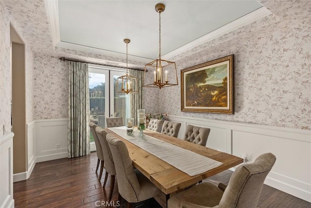 dining area with dark wood-type flooring and ornamental molding