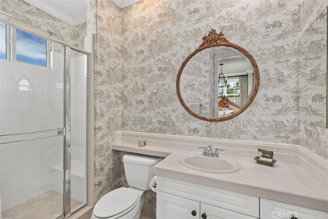 bathroom featuring toilet, a healthy amount of sunlight, crown molding, and an enclosed shower