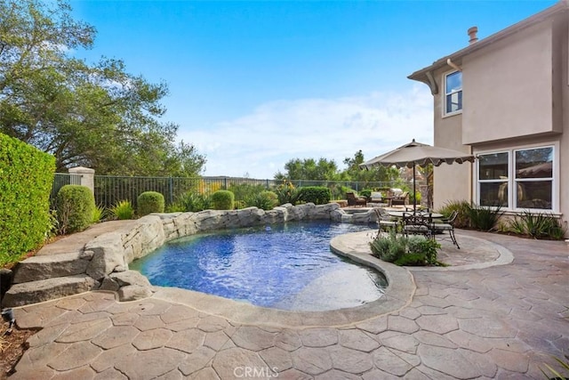 view of swimming pool featuring a patio area