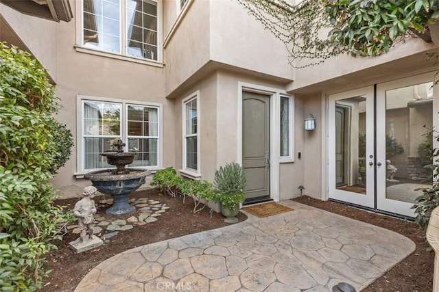 property entrance with french doors and a patio area