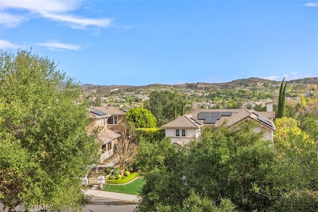 birds eye view of property with a mountain view