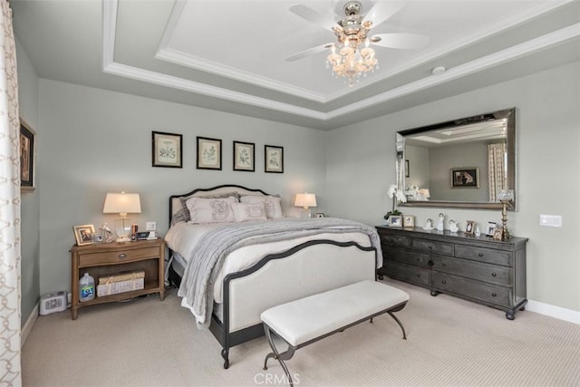 bedroom featuring a raised ceiling, light colored carpet, ceiling fan, and ornamental molding