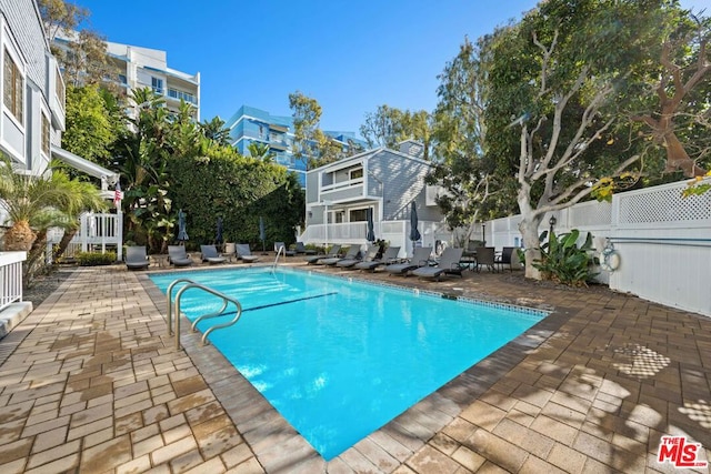 view of pool featuring a patio area