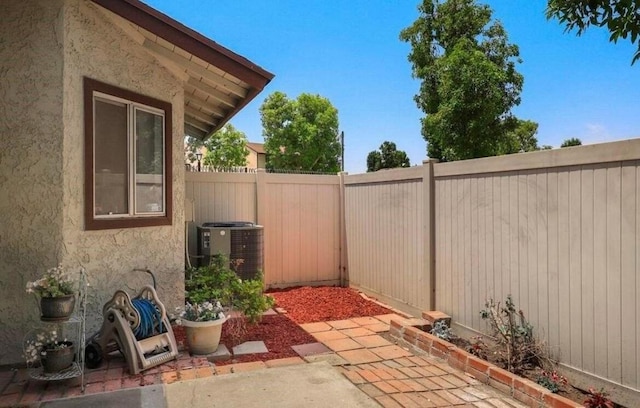 view of patio with central AC unit