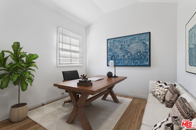 office area featuring lofted ceiling and light wood-type flooring