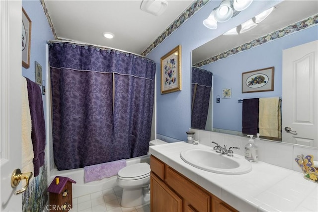 full bathroom featuring toilet, vanity, shower / tub combo, and tile patterned floors