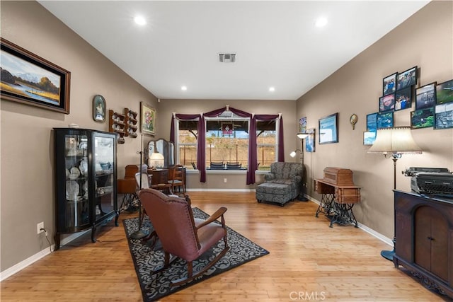 sitting room with light hardwood / wood-style floors