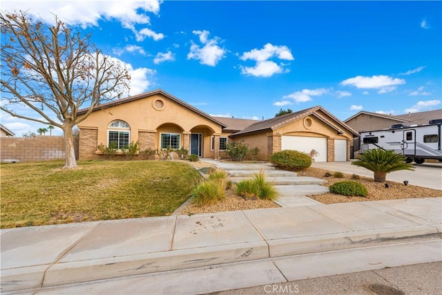 view of front of property featuring a front lawn and a garage