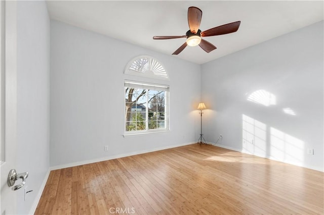 spare room featuring ceiling fan and light wood-type flooring