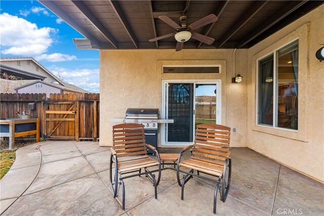 view of patio featuring ceiling fan and a grill