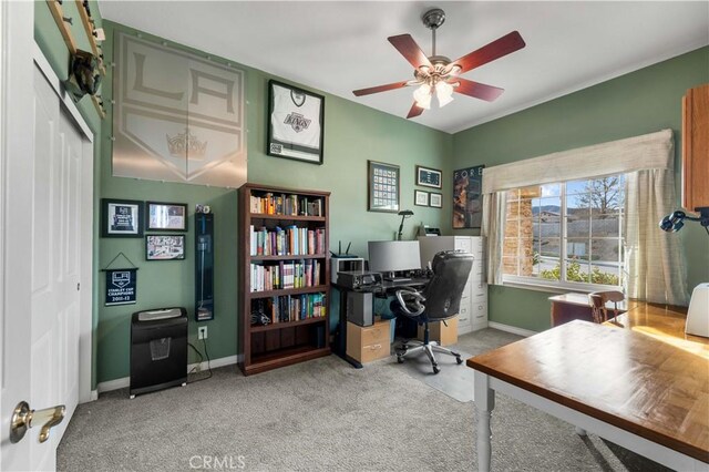 office featuring ceiling fan and light colored carpet