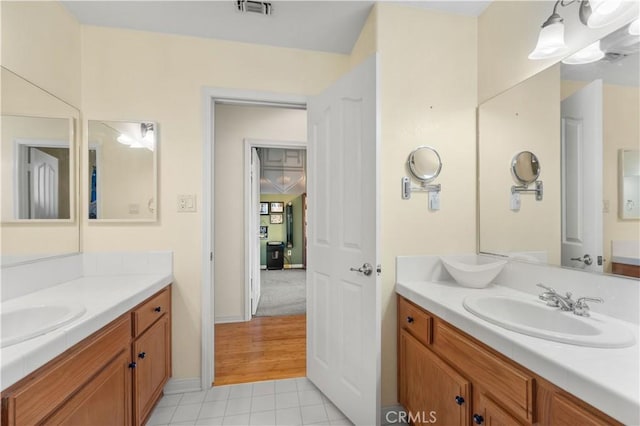 bathroom with vanity and tile patterned floors