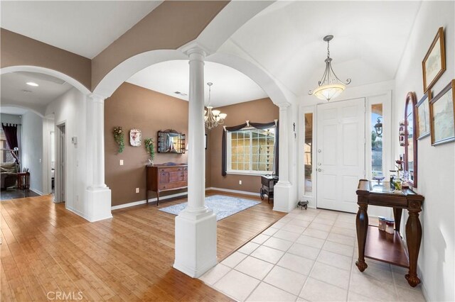 foyer featuring light hardwood / wood-style flooring and a chandelier