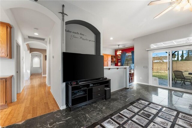 living room with ceiling fan