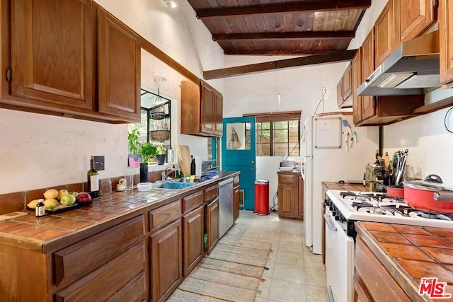 kitchen with exhaust hood, tile countertops, lofted ceiling with beams, white range with gas cooktop, and wooden ceiling