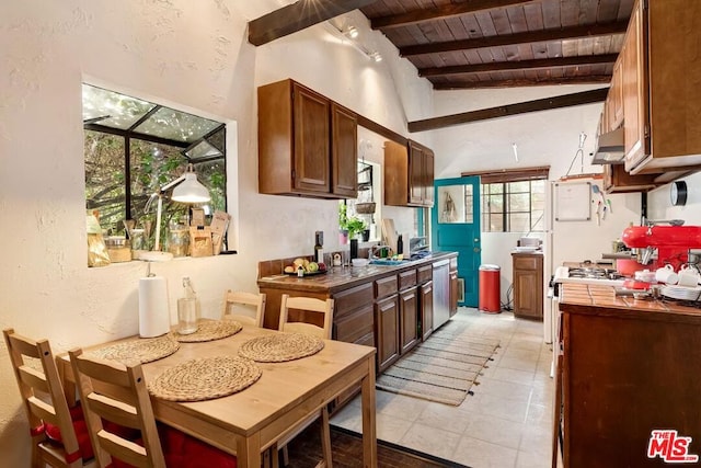 kitchen featuring wood ceiling, vaulted ceiling with beams, and sink