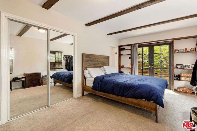 carpeted bedroom featuring ceiling fan, french doors, and beamed ceiling