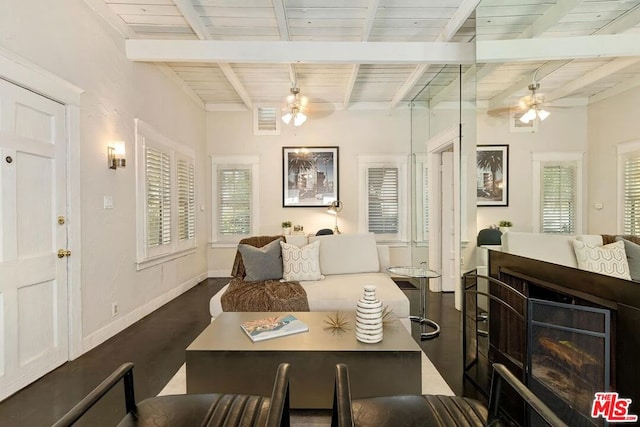 living room with beam ceiling, ceiling fan, dark hardwood / wood-style flooring, and wooden ceiling