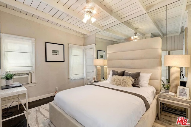 bedroom with cooling unit, ceiling fan, beam ceiling, and hardwood / wood-style floors