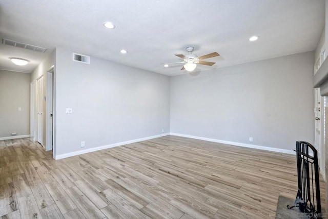 unfurnished room featuring light wood-type flooring and ceiling fan