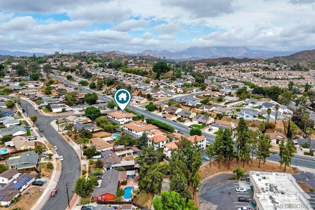 birds eye view of property featuring a mountain view