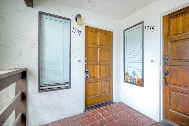 doorway to property with a porch