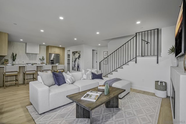 living room with light hardwood / wood-style flooring