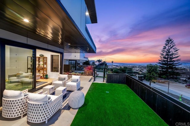 exterior space featuring outdoor lounge area and a lawn