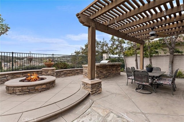 view of patio / terrace with an outdoor fire pit, area for grilling, and a pergola